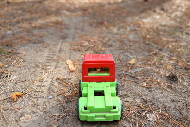 istock Toy truck on a forest road 681807900