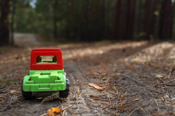 istock Toy truck on a forest road 681808706
