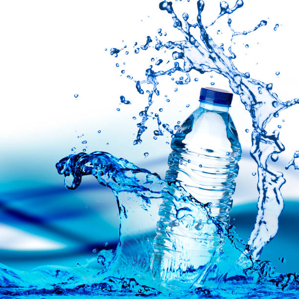 istock beautiful water Bottle with spray on background 681814098