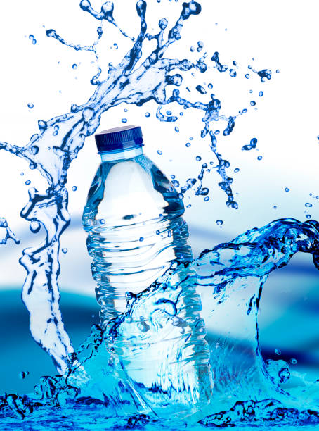 istock beautiful water Bottle with spray on background 681814232
