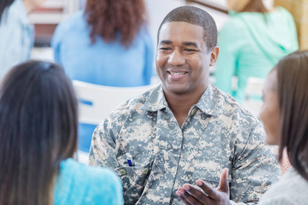 istock Cheerful African American military officer talks with students 681816952