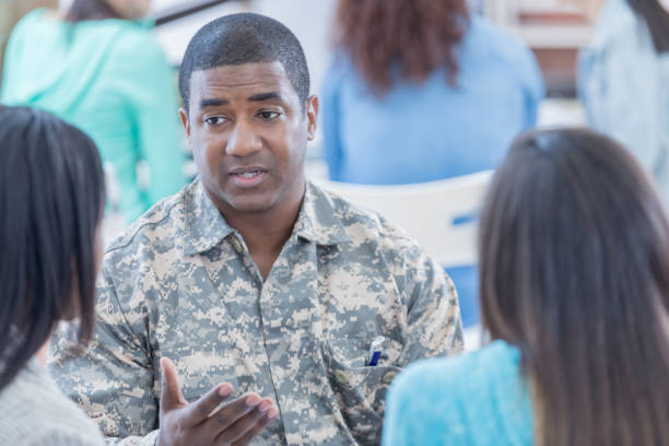 istock Military veteran talks with college students about enlistment 681816954