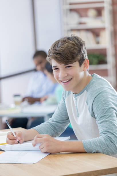 istock Handsome male high school student at school 681816998