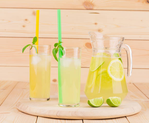 istock Pitcher and glasses full of tasty lemonade. 681820362
