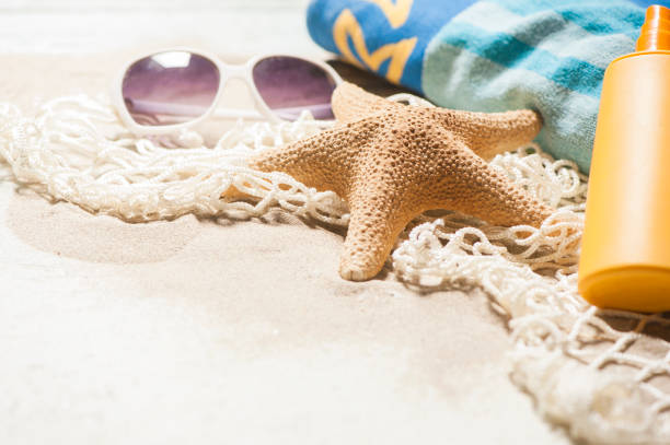 istock Beach on sunny day with wooden walkway and beach accessories 681820638