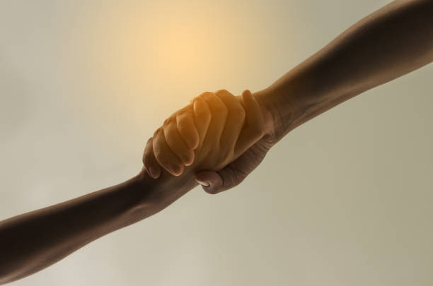 istock Helping hand to hand on nature background 681821458