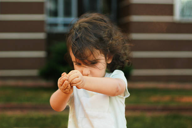 istock The child is playing with sand 681838788