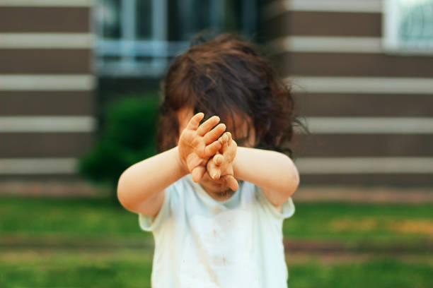 istock The child is playing with sand 681839154