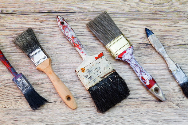 istock Old dirty grunge paintbrushes on dirty rusty wooden background 681845702