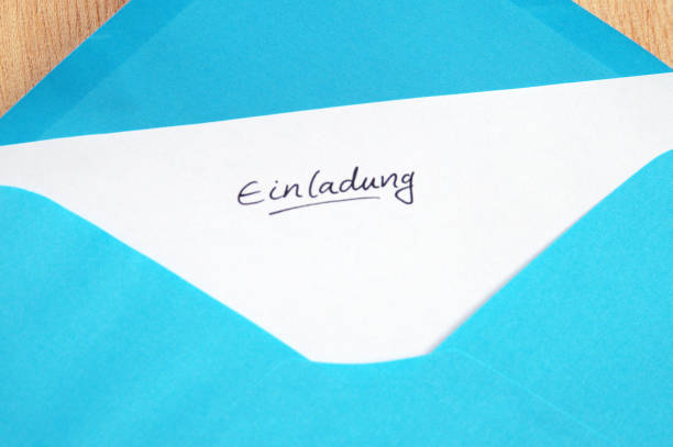 istock Einladung (Invitation), handwritten letter in blue envelope 681845916