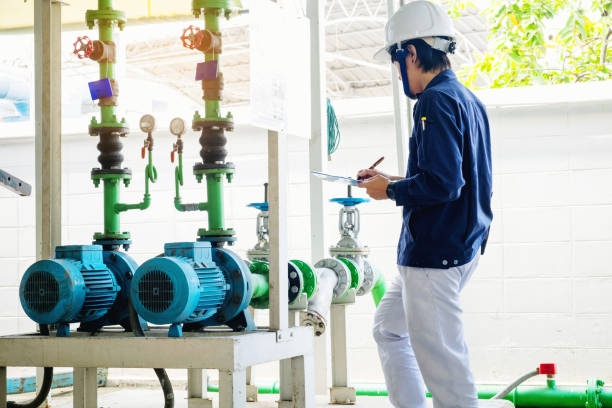 Technician servicing an water Motor Cooling Tower in factory