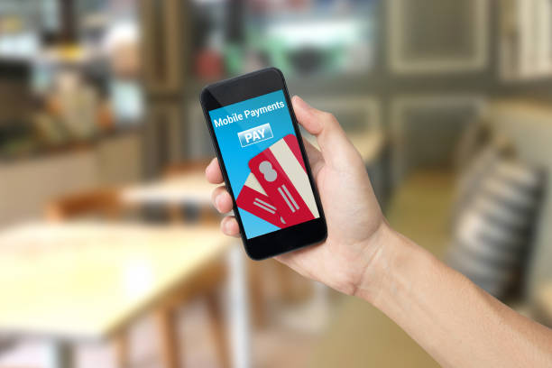 istock hand holding smart phone with 