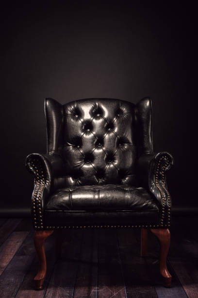 Black vintage leather armchair stock photo
