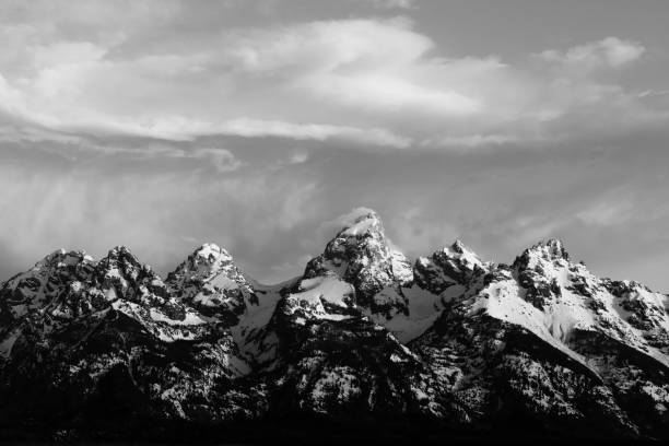 Grand Teton National Park in Morning Mist The Grand Teton mountain range in Grand Teton National Park at sunrise. snake river valley grand teton national park stock pictures, royalty-free photos & images