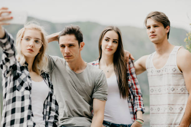 istock Group of handsome friends taking a selfie 681862172
