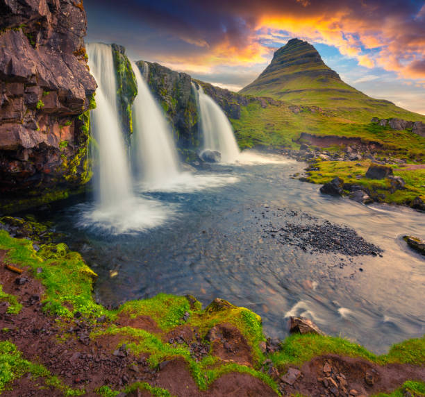 istock Summer sunset on famous Kirkjufellsfoss Waterfall 681867402