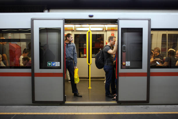 Picture of a open subway door in vienna subway, where poeple drive with.