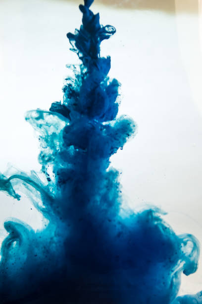 istock blue ink in water isolated on white background 681877398