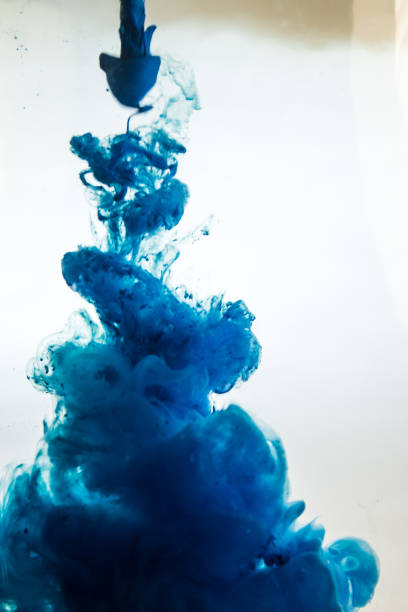 istock blue ink in water isolated on white background 681881866