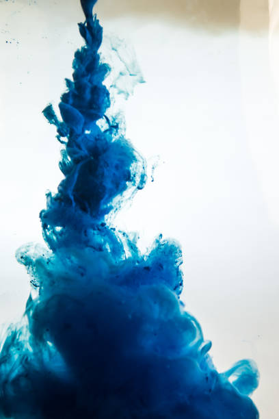 istock blue ink in water isolated on white background 681881870
