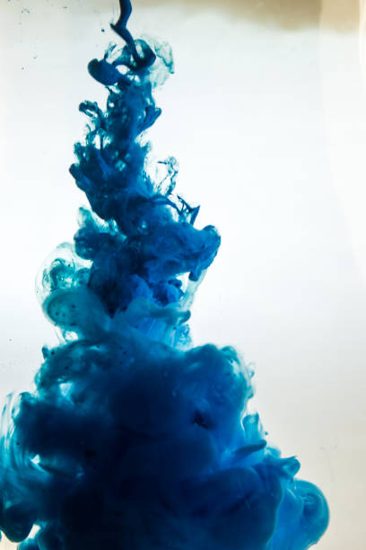 istock blue ink in water isolated on white background 681881886