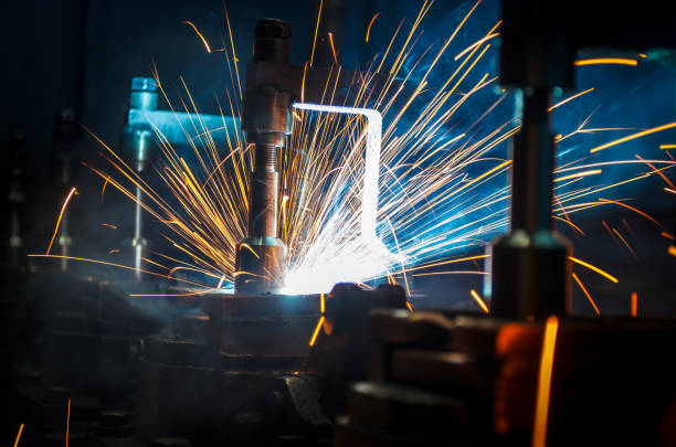 istock Welding robots movement in a car factory 681882630