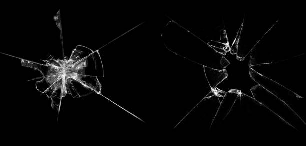 黒の背景にガラスの破片 - bullet hole glass cracked hole ストックフォトと画像