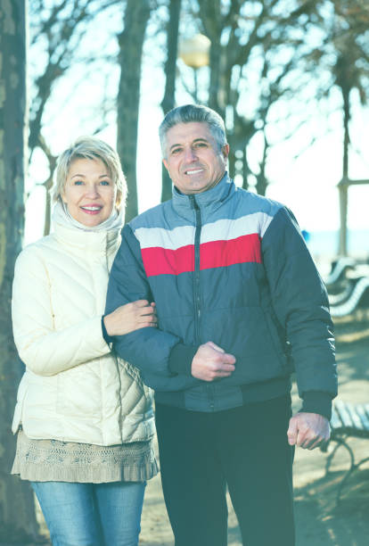 istock Mature couple walking on sunny day 681883278