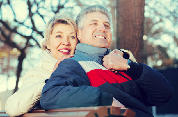 istock Mature couple on park bench 681883282