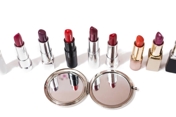 istock Lipstick isolated on white background. Reflection of lipstick in the mirror. Composition with makeup and a mirror. View from above . Concept. Gift girl. Decorative cosmetics 681885866