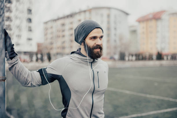 istock Bearded athlete exercising on the field 681886252