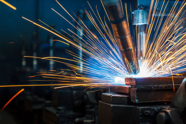 istock Welding robots movement in a car factory 681889336