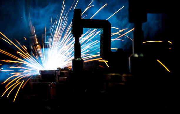 istock Welding robots movement in a car factory 681889614