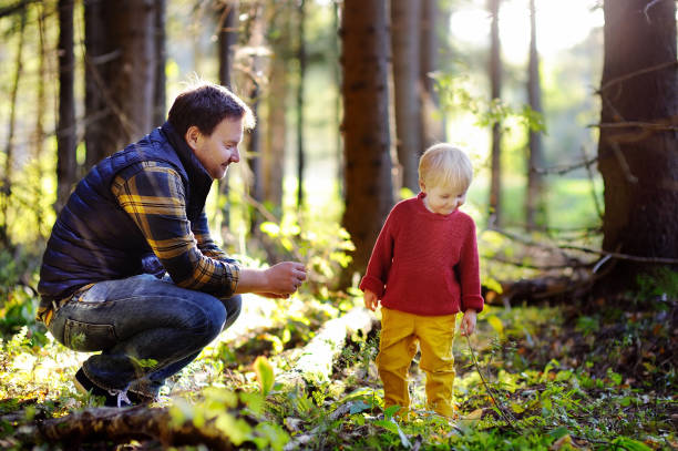 istock Father and his son walking during the hiking activities in forest 681896138