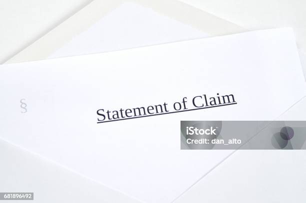 Statement Of Claim Printed On White Paper And Envelope White Background Stock Photo - Download Image Now