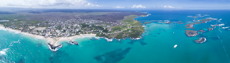 Huge aerial panorama of the beautiful Isla Isabela, its beautiful white sand beaches and the Las Tintoreras Islands on the right, Galapagos Islands, Ecuador