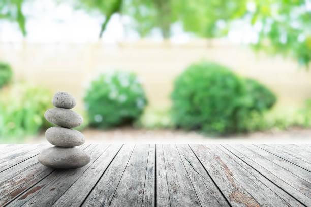 zen stones on wooden in Japanese garden spring Season. stock photo