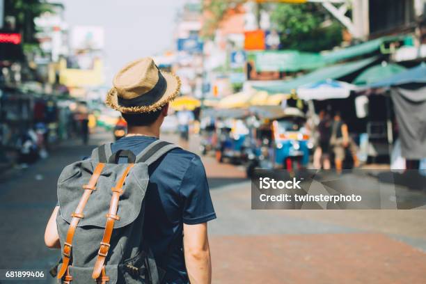 Young Asian Traveling Backpacker In Khaosan Road Outdoor Market Stock Photo - Download Image Now