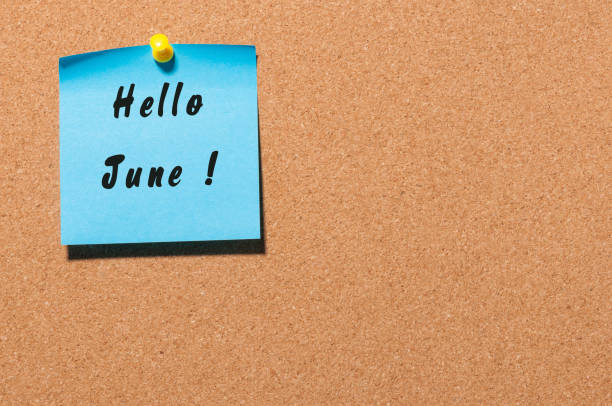 istock Hello June - note pinned to cork notice board. First summer month beginning. With empty space for text 681899630