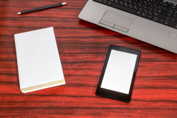 istock Book and a tablet on office desk 681899716