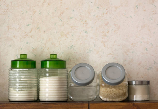 istock jars with flour, sugar, rice, cereals on a wooden shelf, kitchen 681900112