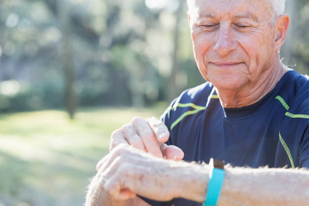 istock Senior man in his 70s using fitness tracker 681900532