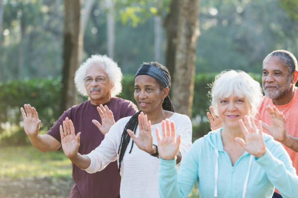 istock Multi-ethnic group of seniors taking tai chi class 681902658