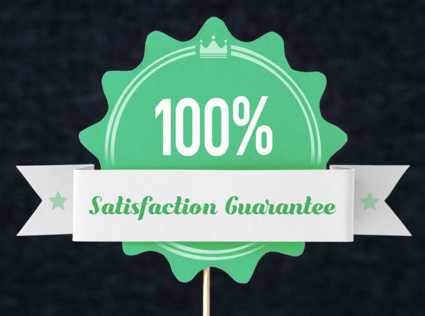 100% satisfaction guarantee badge cut from cardboard and paper on a wooden stick. Green banner, seal and ribbon for business website to promise customer the best premium quality product or service. Handmade cardboard design papery stock pictures, royalty-free photos & images