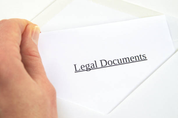 istock Legal Documents printed on white paper and envelope, hand holding it, white background 681904180