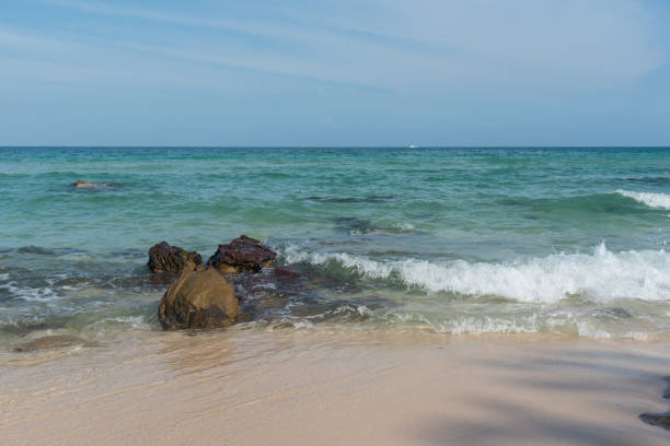 istock rock in the water at the beach 681907584