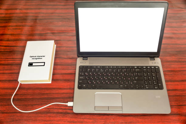 istock Optical character recognition concept. Book and laptop 681910846