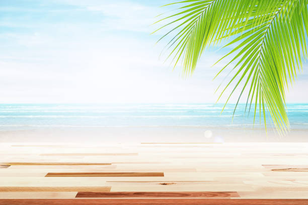 istock old wood table top on blurred beach background. 681911308