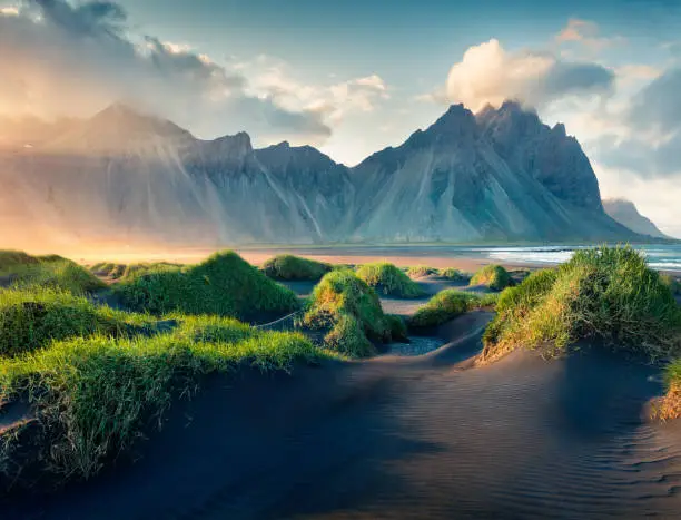 Black sand dunes on the Stokksnes headland on southeastern Icelandic coast. Iceland, Europe. Artistic style post processed photo.