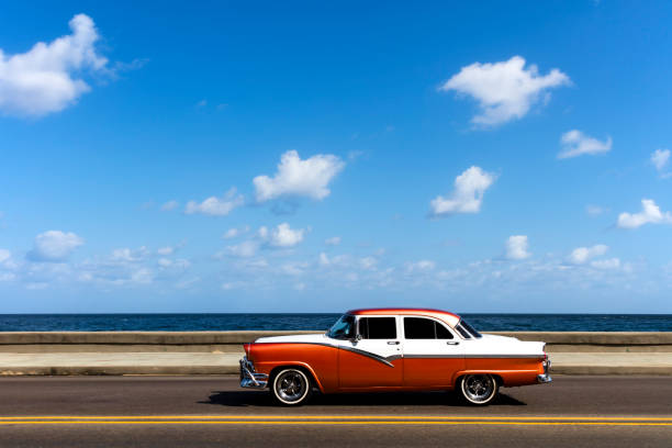 istock American Classic Car Speeding on El Malecon, Havana 681917448